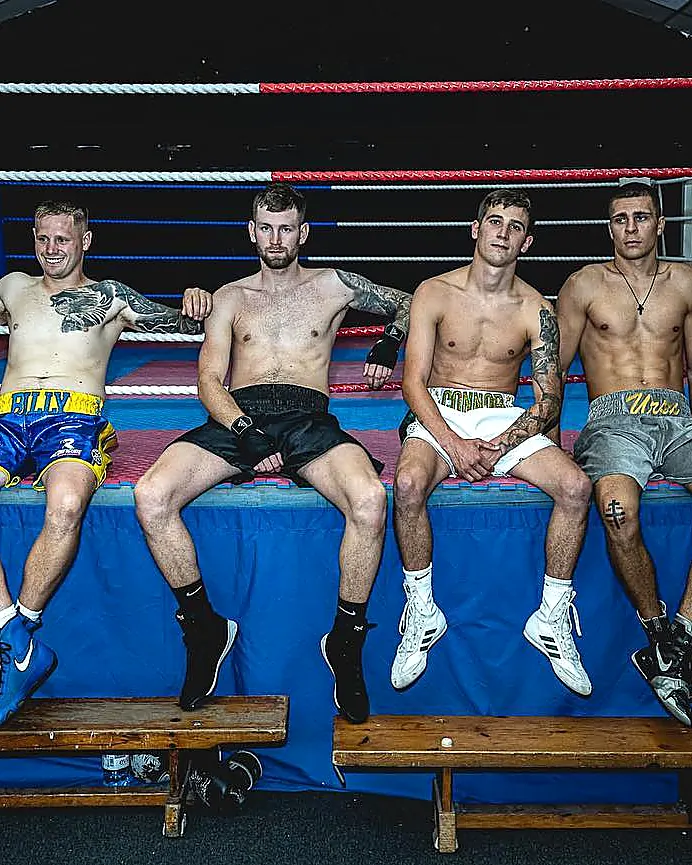 Adult boxers seated ringside at Intense Boxing, Plymouth