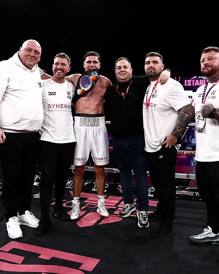 Coaching team with a professional boxer at a show