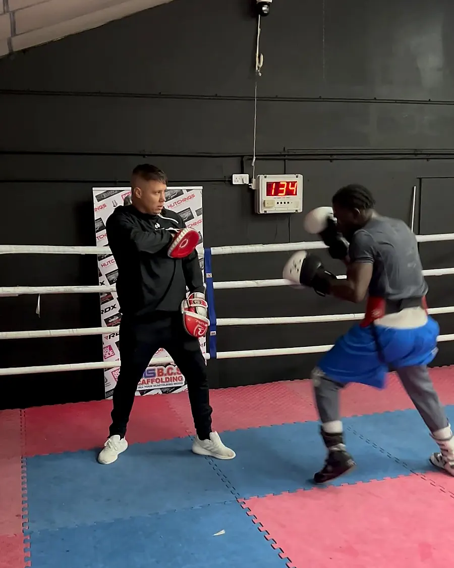 Coach and boxer on the pads at Intense Boxing