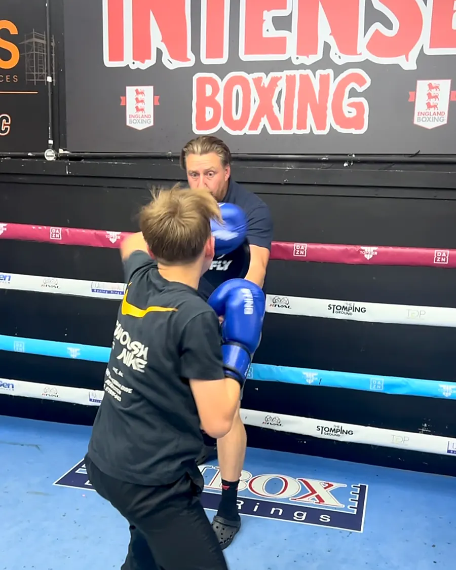 Coach padwork in the ring at Intense Boxing (junior session)